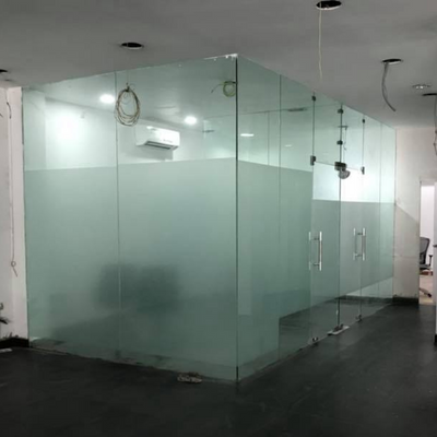 Modern half glass partition in bathroom enhancing space separation with a sleek, elegant glass design